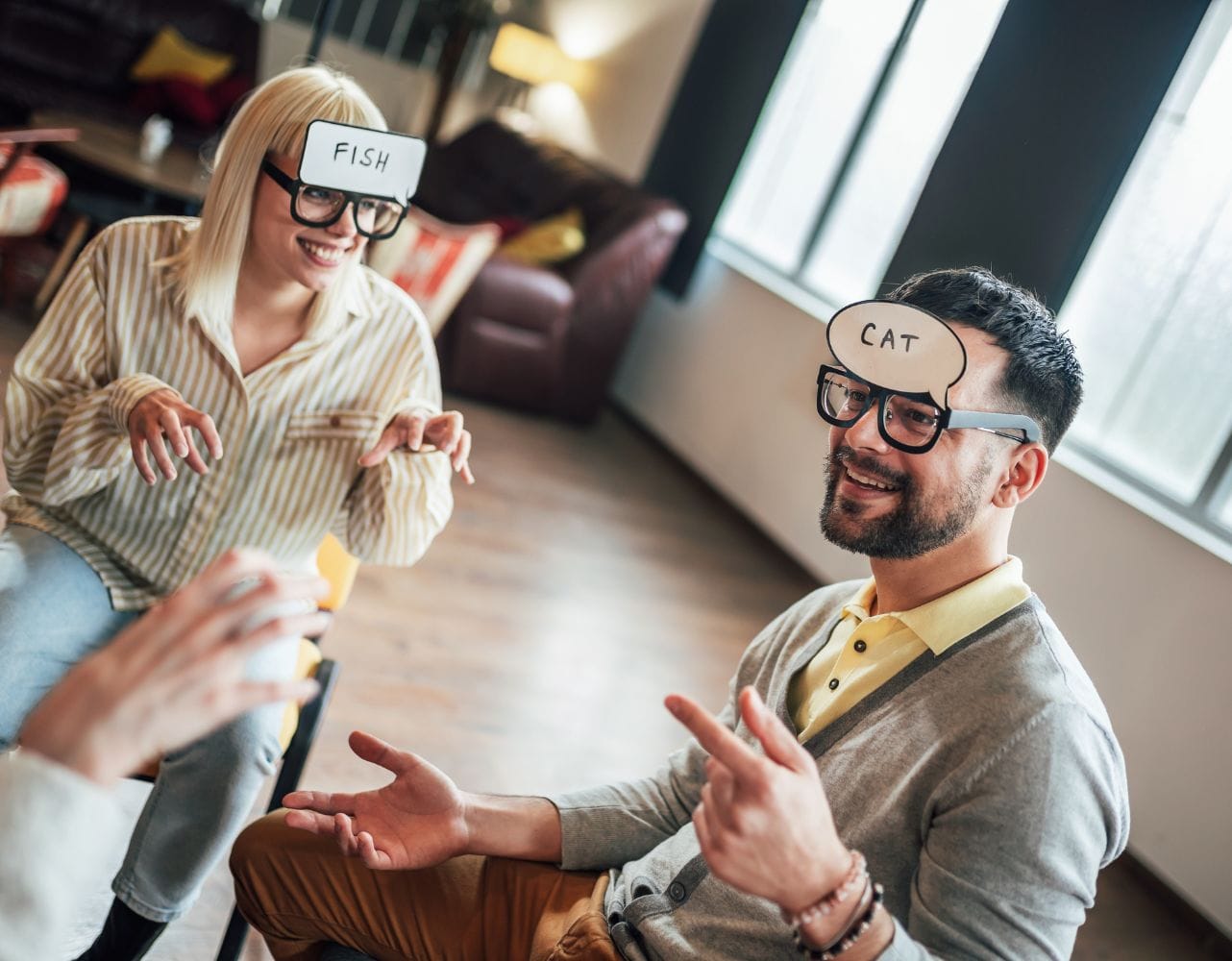 Team members play a guessing game to build trust in a cross-cultural communication workshop