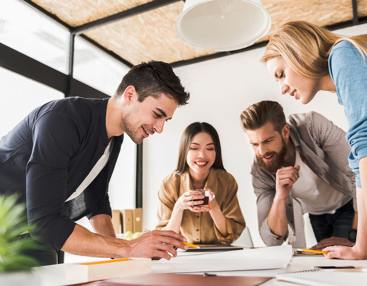 Employees work together on a task during a team dynamics workshop session