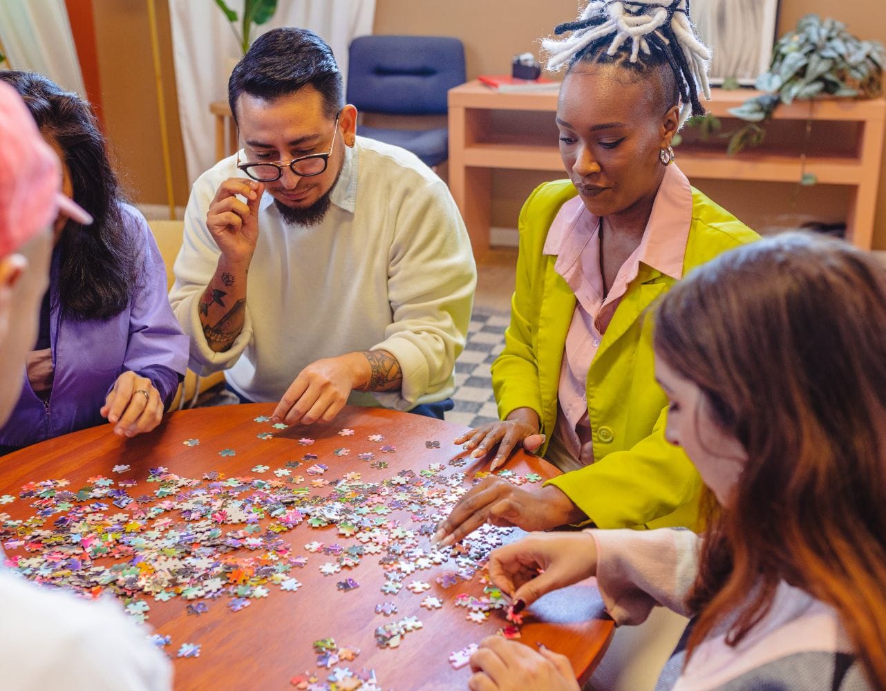 Participants engage in a collaborative art workshop to build creativity and team rapport