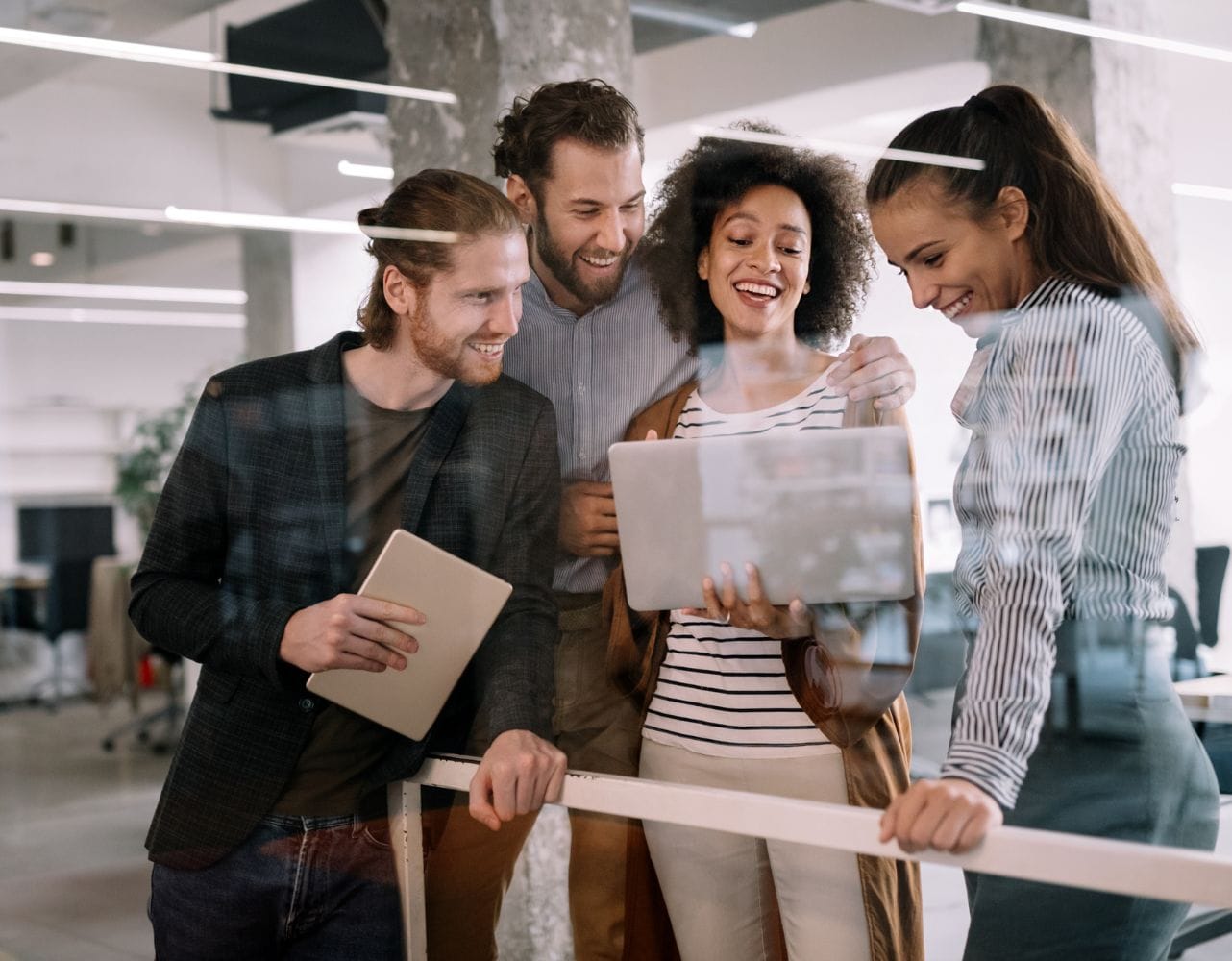 Employees apply learning from corporate pitch training during an office session