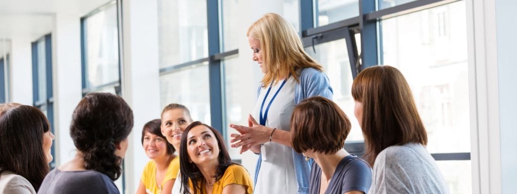 mixed-age team attending a corporate workshop to improve internal communication