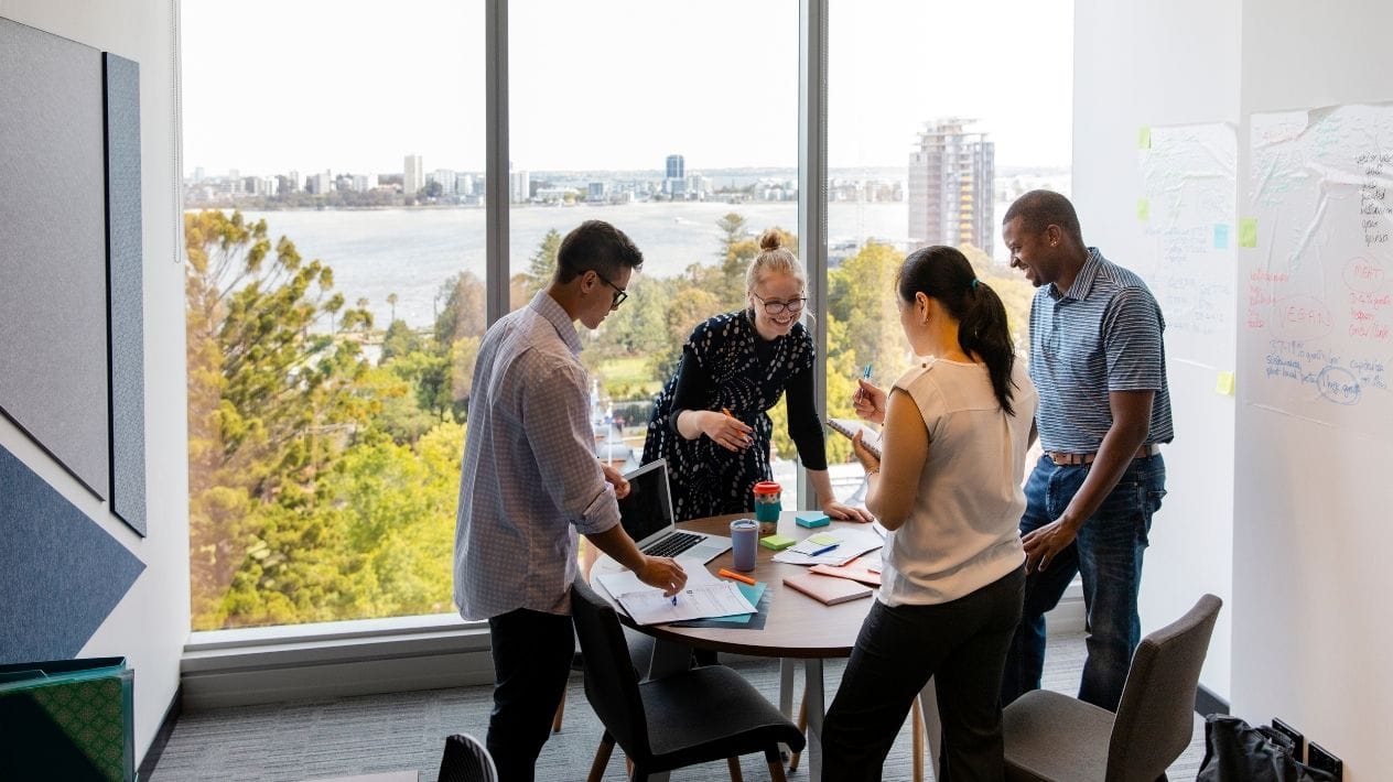 Colleagues engaged in a collaborative discussion during a team brainstorming session