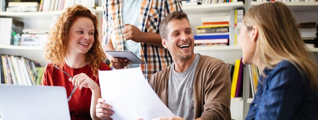 employees collaborating better after attending a workplace wellbeing workshop